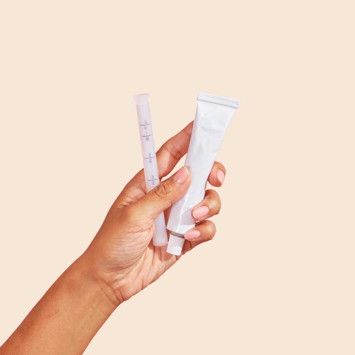 Estradiol cream tube and applicator shown by Wisp
